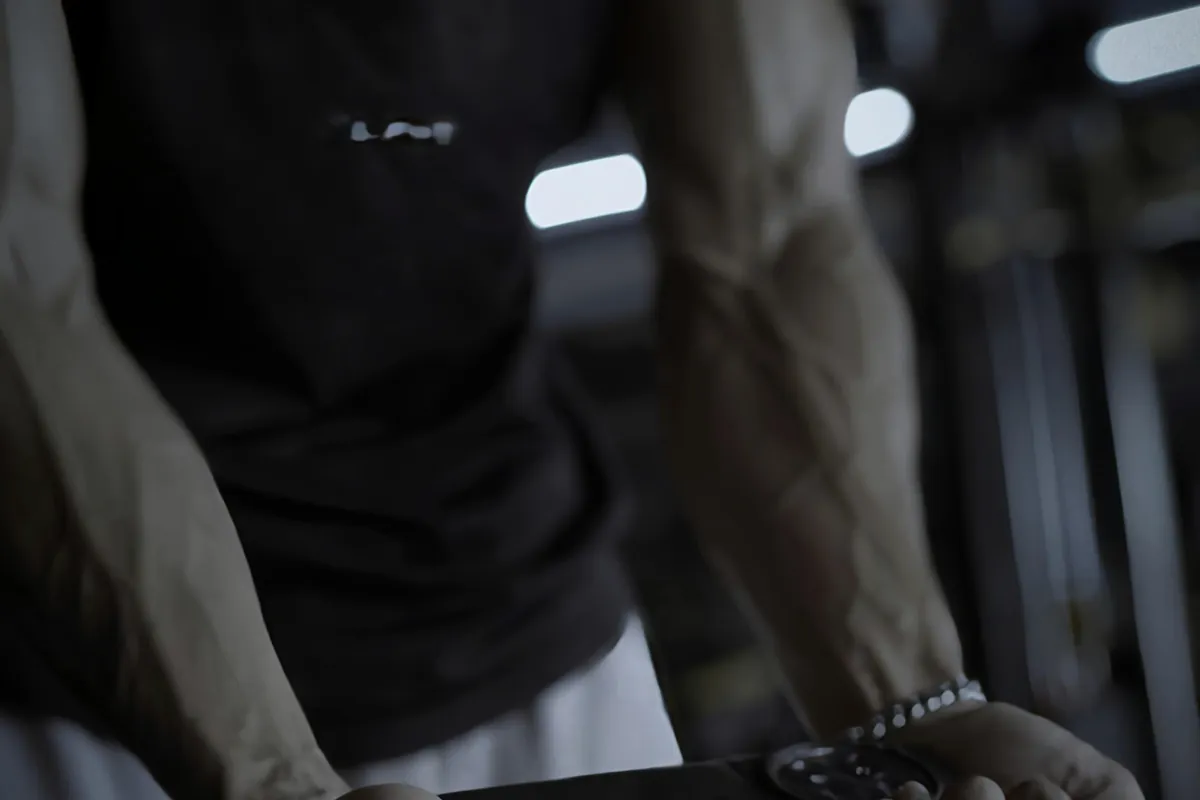 Close-up of a loaded barbell held mid-set